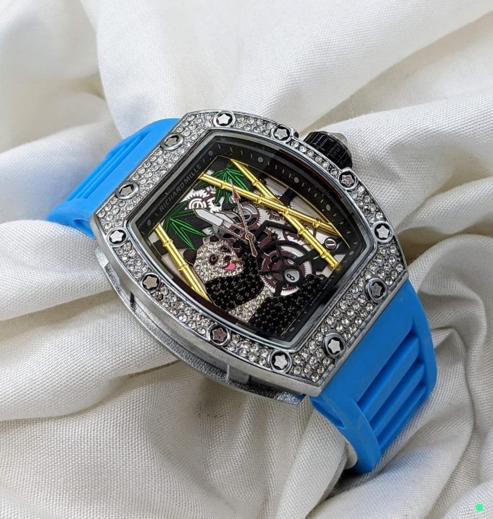 Richard Mille Diamond Stone Watch – a timepiece that blends exquisite craftsmanship with the brilliance of diamond accents. This watch is designed for those who appreciate the finest things in life and want a watch that reflects their impeccable taste and love for elegance. Whether it’s for a special occasion, a formal gathering, or a statement piece for everyday wear, the Richard Mille Diamond Stone Watch is the perfect choice for discerning individuals. Genuine Diamond Stone Accents for Unmatched Luxury The standout feature of this watch is its stunning diamond stone embellishments, which elevate its design to new heights. Diamonds are known for their timeless beauty and rarity, and the inclusion of these precious stones adds a touch of opulence and exclusivity to this timepiece. These diamonds are carefully selected and expertly placed, ensuring that the watch exudes sophistication and allure. Whether you're attending a formal event or simply want to showcase your unique style, the diamond stone accents will undoubtedly make you the center of attention. Date Function for Everyday Practicality In addition to its luxurious look, the Richard Mille Diamond Stone Watch is equipped with a highly practical date function. Positioned clearly on the watch face, this feature allows you to easily track the date, ensuring that you stay organized and punctual. The date display is designed to complement the overall aesthetic of the watch, adding a functional element without compromising the watch’s elegant design. For those who appreciate practicality alongside style, this feature is sure to be a favorite. Heavy Quality Construction for Durability When it comes to quality, this watch does not disappoint. Crafted with heavy-duty materials, the Richard Mille Diamond Stone Watch is designed to withstand the test of time. The heavy quality construction ensures that the watch is not only a symbol of luxury but also a practical, long-lasting accessory. Whether you're wearing it for daily activities or for special occasions, you can be confident that this timepiece will remain durable and reliable. The sturdy build ensures that it’s resistant to daily wear and tear, keeping it looking as pristine as the day you bought it. Excellent Finishing for a Premium Look The finish on this Richard Mille watch is second to none. The attention to detail in every aspect of the design is evident, from the smooth edges of the case to the polished surface of the band. The craftsmanship and precision with which this watch is made are clear in the flawless finish that gleams with every movement. Whether you're looking at the watch up close or from afar, the impeccable finishing creates an air of sophistication that is bound to impress. This timepiece offers both high performance and a premium aesthetic, making it the perfect blend of form and function. Versatile and Elegant Design The Richard Mille Diamond Stone Watch is versatile enough to be worn with both formal and casual attire. Its refined design allows it to seamlessly complement a wide range of looks, from business suits to evening wear. Whether you’re attending an important meeting or a night out, this watch will add the perfect finishing touch to your outfit. The combination of diamond accents, date functionality, and heavy quality construction ensures that it can be worn confidently for a variety of occasions. Why Choose Richard Mille? Richard Mille is a name synonymous with excellence in luxury watches. When you choose a Richard Mille watch, you’re choosing more than just a timepiece – you're choosing a statement of elegance, precision, and high-end craftsmanship. The Richard Mille Diamond Stone Watch stands out in terms of both design and performance, offering an ideal mix of luxury and practicality. If you're looking for a watch that not only looks stunning but also offers lasting durability, this timepiece is the perfect addition to your collection. Key Features: Genuine Diamond Stone Accents for luxurious elegance and shine Date Function for convenience and practicality Heavy Quality Construction for lasting durability Premium Finish for a flawless, sophisticated look Versatile design suitable for formal and casual occasions The Richard Mille Diamond Stone Watch is the perfect blend of luxury, functionality, and durability. Make a statement and enjoy the elegance of this timepiece. Whether for personal use or as a gift, this watch will undoubtedly impress with its timeless beauty and exceptional performance. Don’t miss the opportunity to own this exquisite luxury accessory that will serve as a true symbol of sophistication.