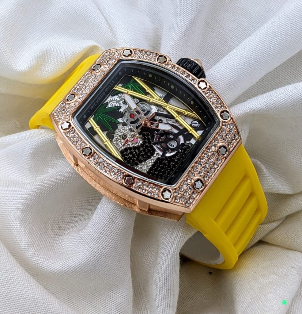 Richard Mille Diamond Stone Watch – a timepiece that blends exquisite craftsmanship with the brilliance of diamond accents. This watch is designed for those who appreciate the finest things in life and want a watch that reflects their impeccable taste and love for elegance. Whether it’s for a special occasion, a formal gathering, or a statement piece for everyday wear, the Richard Mille Diamond Stone Watch is the perfect choice for discerning individuals. Genuine Diamond Stone Accents for Unmatched Luxury The standout feature of this watch is its stunning diamond stone embellishments, which elevate its design to new heights. Diamonds are known for their timeless beauty and rarity, and the inclusion of these precious stones adds a touch of opulence and exclusivity to this timepiece. These diamonds are carefully selected and expertly placed, ensuring that the watch exudes sophistication and allure. Whether you're attending a formal event or simply want to showcase your unique style, the diamond stone accents will undoubtedly make you the center of attention.